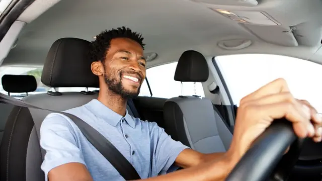 Smiling man driving a car
